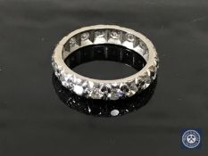 A diamond full eternity ring in white metal, approximately 1ct.