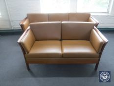 A late 20th century wood framed three seater and two seater settees in brown leather