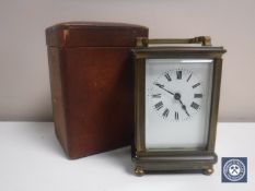 A leather cased brass carriage clock with key