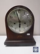 A Victorian inlaid mahogany bracket clock with silvered dial,