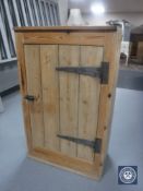 A 20th century pine cabinet with metal hinges