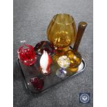 A tray of seven pieces of coloured glass ware including two amber glass vases, ruby bowl and basket,