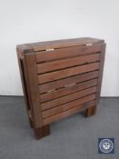 A narrow teak drop leaf garden table CONDITION REPORT: In good condition with no