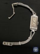 A lady's platinum diamond set cocktail watch CONDITION REPORT: Fully wound and not
