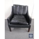 A mid 20th century black leather armchair