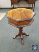 A Victorian style mahogany work table,