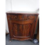 An antique continental mahogany cabinet fitted a drawer