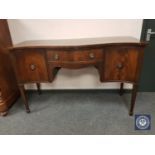 A 19th century serpentine fronted sideboard,