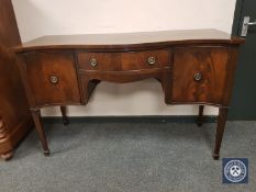 A 19th century serpentine fronted sideboard,