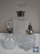 A cut glass decanter with silver collar,