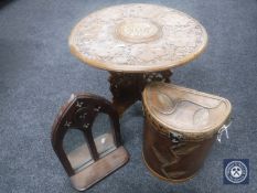 A folding carved tripod table,