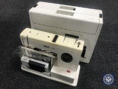 A cased Psaff 11097 electric sewing machine