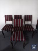 A set of four oak dining chairs in striped fabric