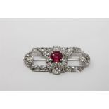 A fine quality diamond and ruby brooch set in platinum,