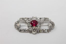 A fine quality diamond and ruby brooch set in platinum,
