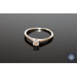 An 18ct white gold round cut diamond solitaire ring, approximately 0.25ct, size P.