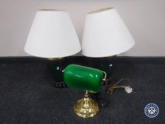 A banker's desk lamp and a pair of green pottery table lamps