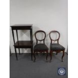 A pair of mahogany side tables and a pair of antique mahogany balloon back dining chairs