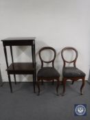 A pair of mahogany side tables and a pair of antique mahogany balloon back dining chairs