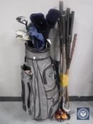 A golf bag containing Donnay irons, assorted drivers,