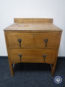 A 20th century oak two drawer chest