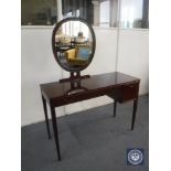 A mid 20th century dressing table with mirror