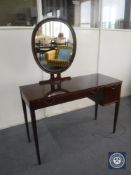 A mid 20th century dressing table with mirror