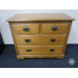 An Edwardian pine four drawer chest