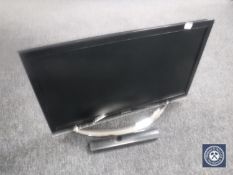 A Samsung 22 inch LCD TV with lead and remote,