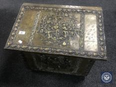 An early 20th century brass embossed coal box