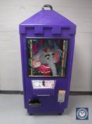 A late 20th century toy vending machine and keys