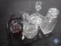 A tray of seven pieces of glass ware - whiskey and ship style decanters, ice bucket,
