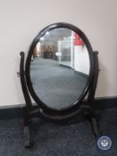 A mahogany toilet mirror on stand