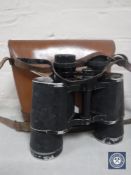 A set of vintage leather cased Hedler 10x50 field glasses