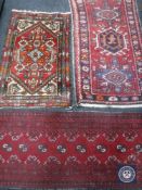 Three fringed Persian hearth rugs