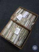 Two boxes containing 7" singles including The Beatles, Rolling Stones, Elvis Presley,