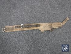 An antique hand-stitched leather ammunition belt