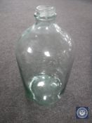 An antique glass demijohn