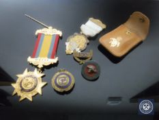 A bag containing two Freemason's medals together with three similar badges