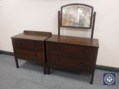 A 1930's oak two drawer dressing table together with matching two drawer chest