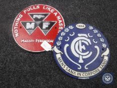 Two circular cast iron plaques;
