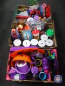 Three boxes containing children's pencil cases, money boxes,