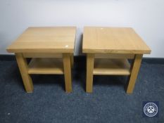 A pair of contemporary oak two-tier lamp tables