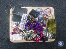 A tray of assorted costume jewellery, pens, cased camera,