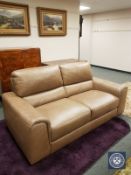 A Barker & Stonehouse Natuzzi brown leather two seater settee,