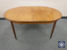 A mid 20th century teak G-Plan oval extending kitchen table