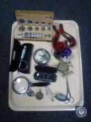 A tray containing set of cased weights, magnifying glass, vintage spectacles, glass eye bath,
