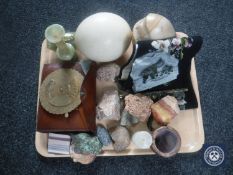 A tray of assorted rock samples, ostrich egg, circular brass calendar,
