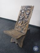 A carved African fertility chair