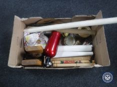 A box containing rolled maps, hand fans, White Horse Whisky coat hanger, book ends,